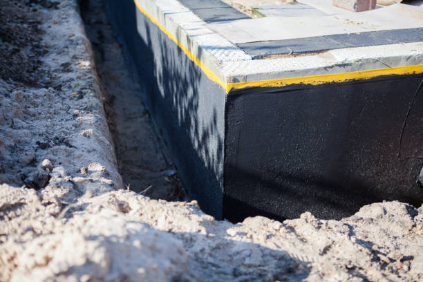 Professional Interior Drainage System technician working in Buchtel, OH